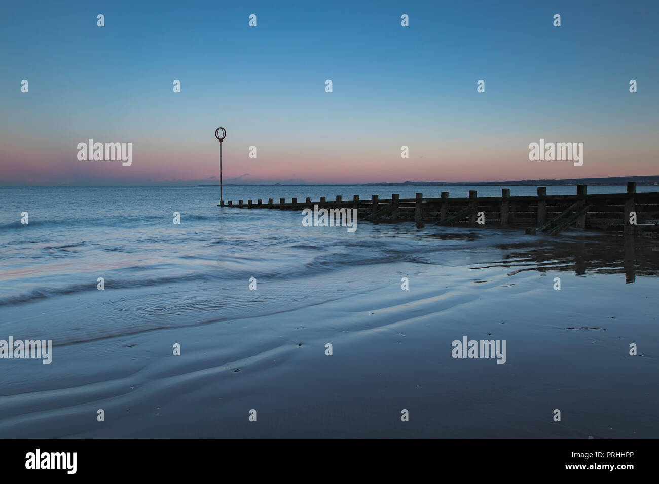 Old wooden Groyne on Portobello beach at sunset, Edinburgh Scotland