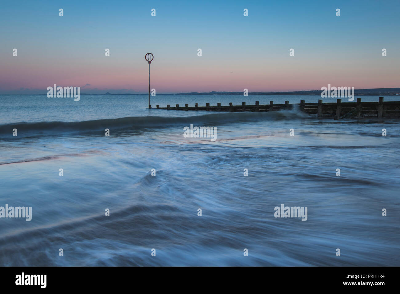 Old wooden Groyne on Portobello beach at sunset, Edinburgh Scotland