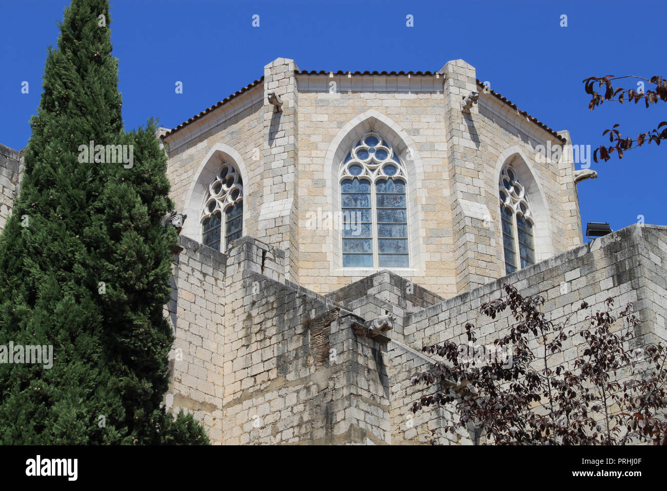 Ancient medieval Church of Sant Peter (Iglesia de San Pedro) in the old town of Figueres, Catalonia, Spain, Europe on a beautiful summer day Stock Photo