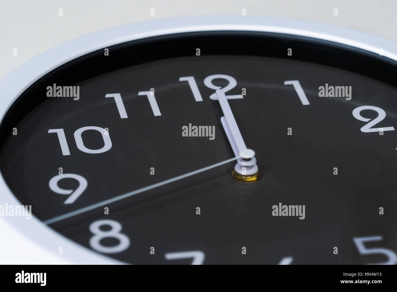 a clock showing at noon Stock Photo Alamy