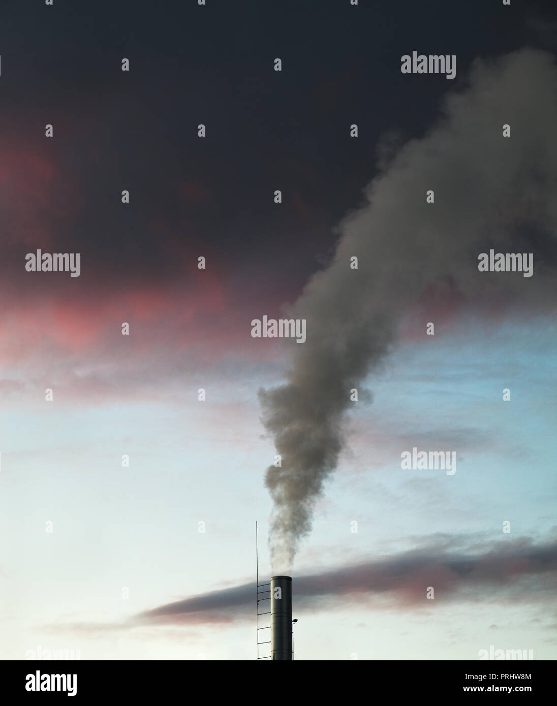 Station with smoke stack and sunset Stock Photo - Alamy