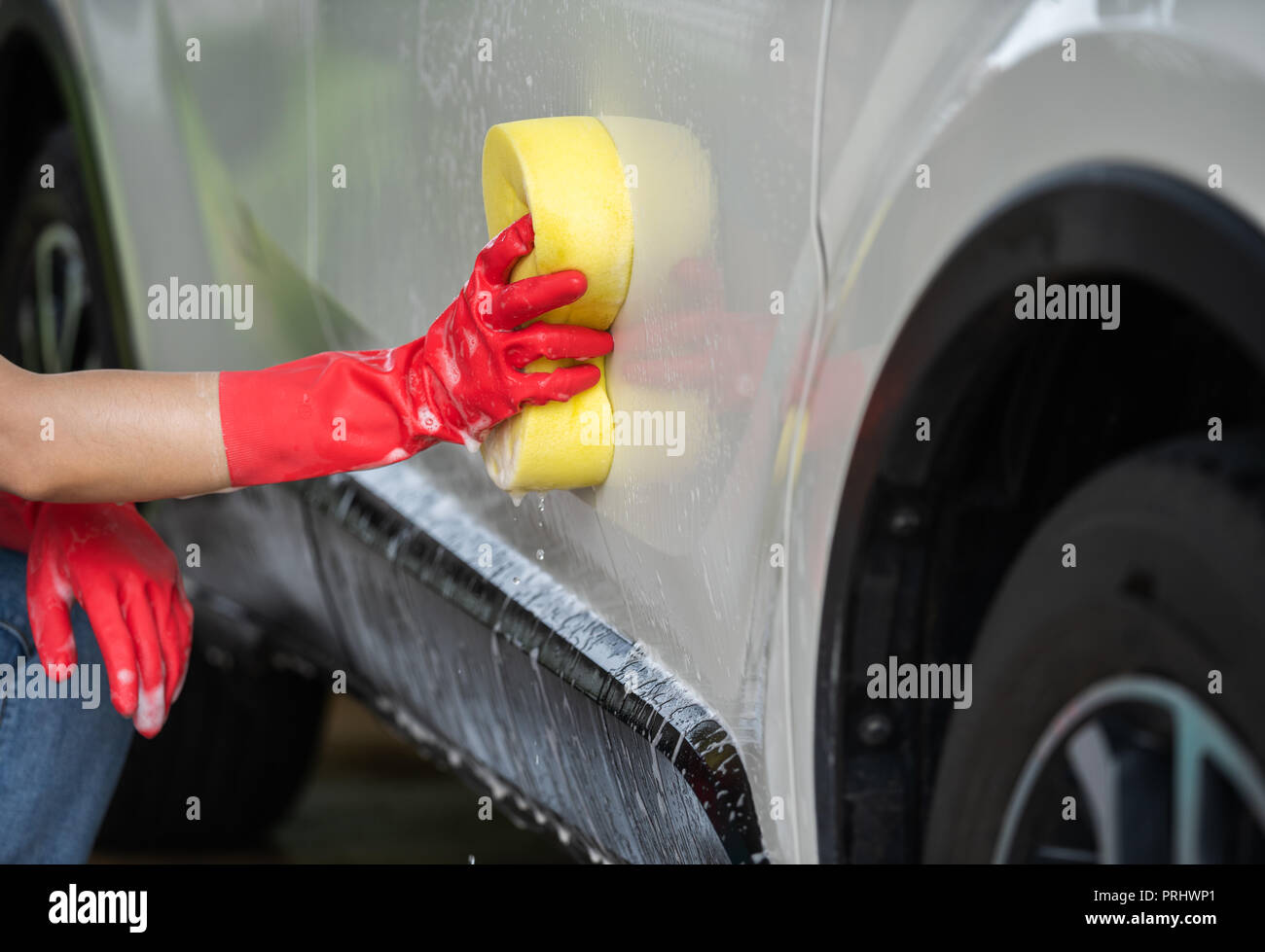 hands holding sponge to washing a car Stock Photo Alamy