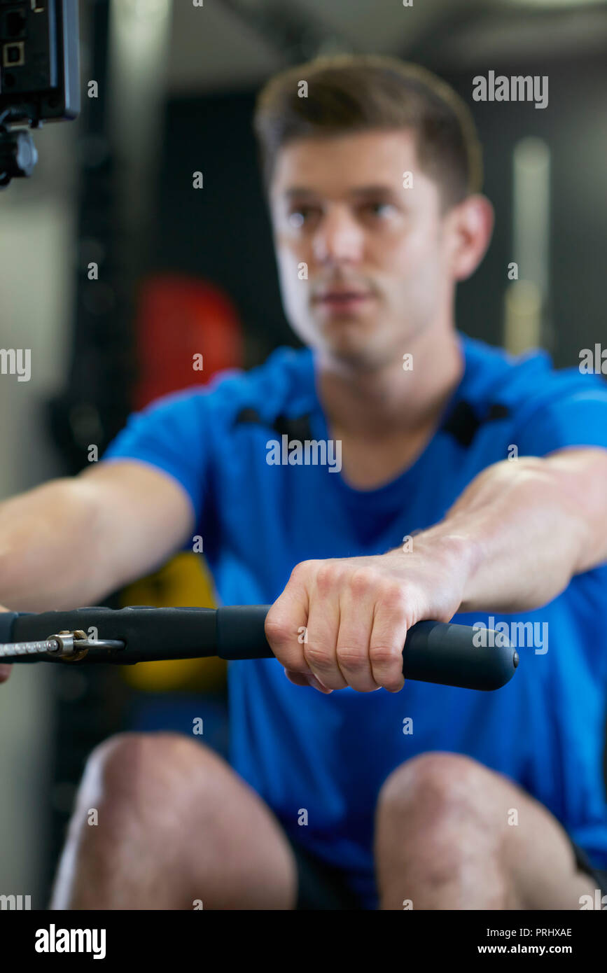 Male on rowing machine hires stock photography and images Alamy