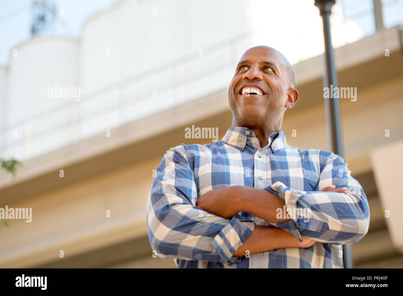 Happy mature African American man smiling outside. Stock Photo