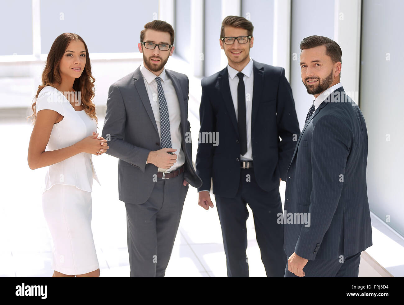 business team standing in the office Stock Photo - Alamy