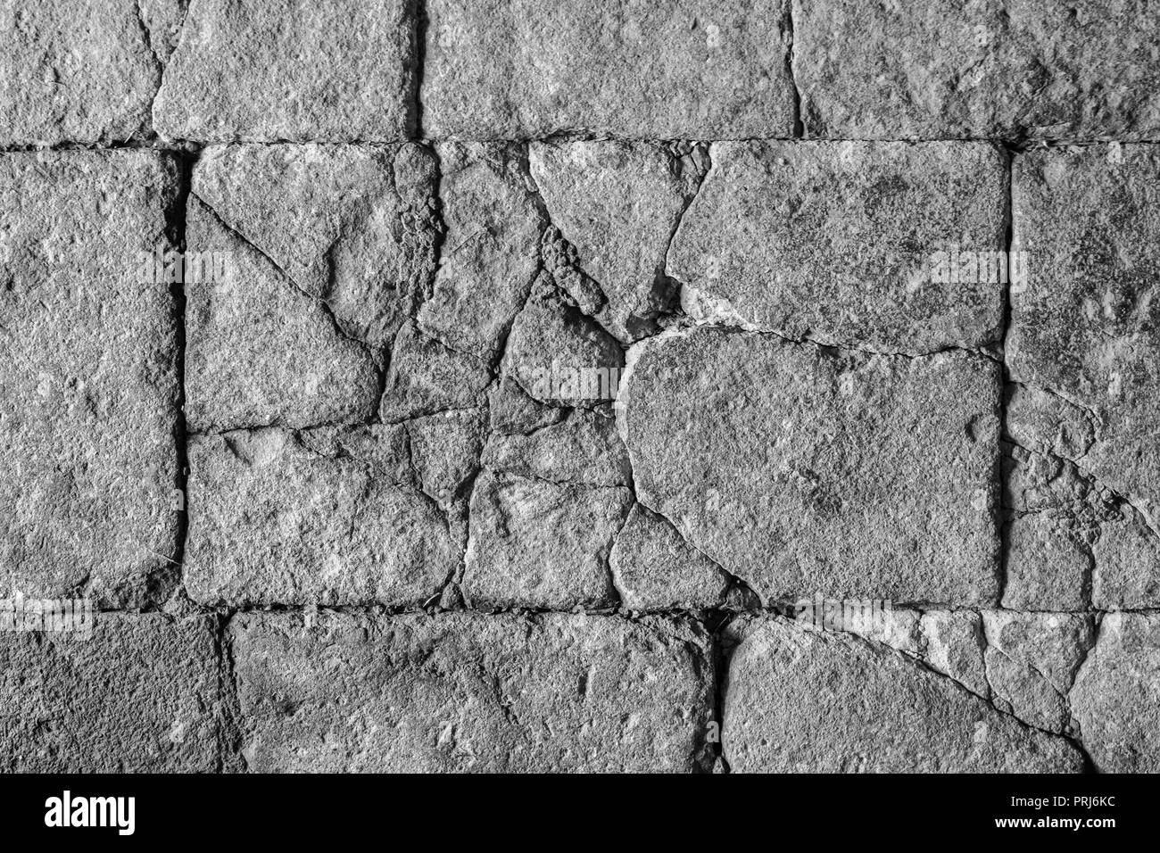 cracked stone texture, antique stone floor / wall with cracks Stock Photo