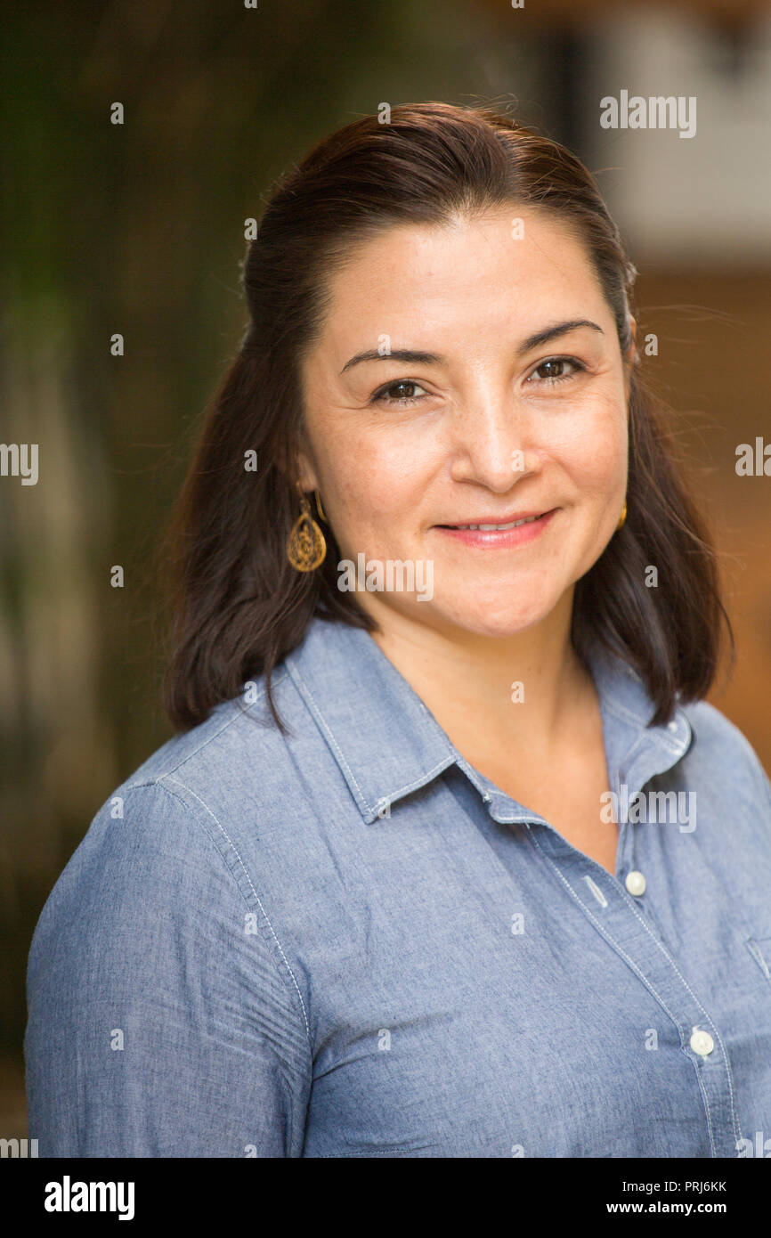 Portrait of a happy Hispnaic woman smiling Stock Photo - Alamy