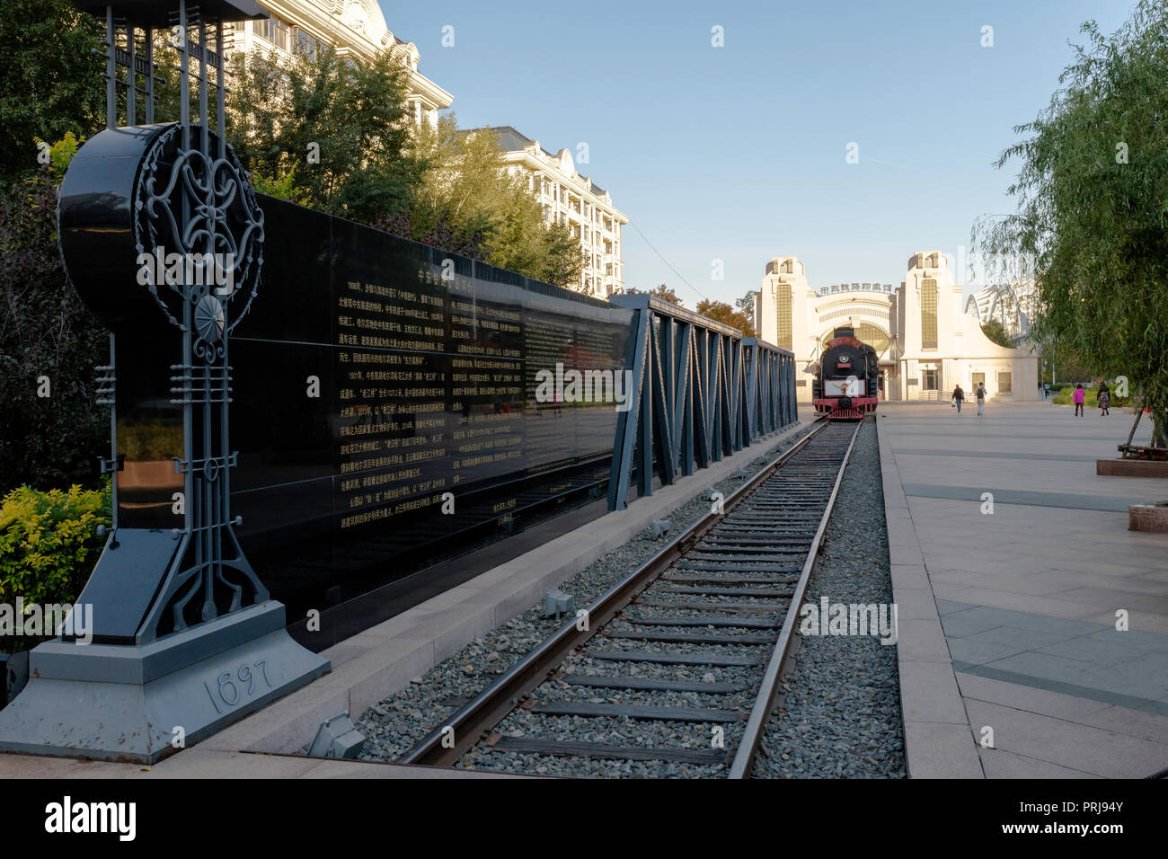 Harbin railway museum, open air, steam trains and a railway bridge day blue sky Stock Photo