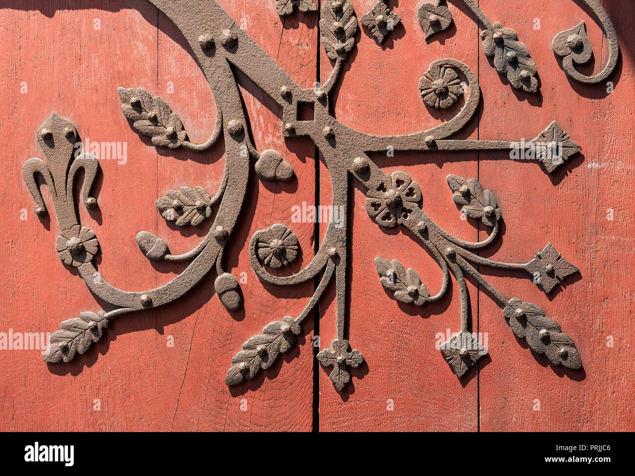 Ornate metal fittings on wooden door, Strasbourg, France Stock Photo