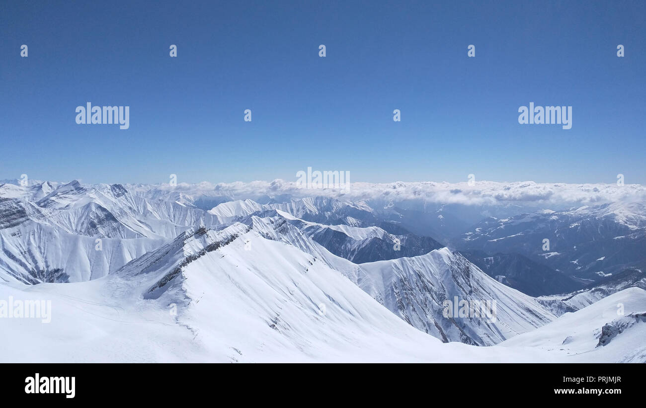 aerial view of snowy mountains and blue sky in Stock Photo Alamy