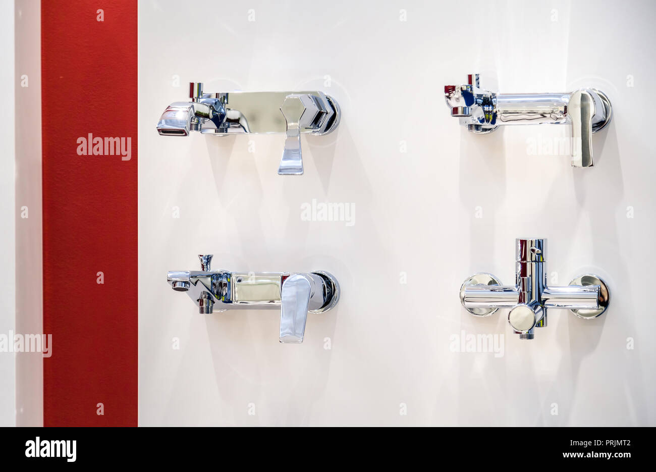 various types of chrome faucets on wall Stock Photo Alamy