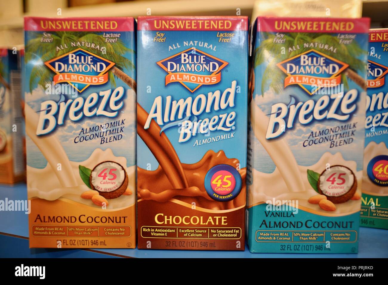 Almond milk made from almonds, in cardboard containers on shelf, sold