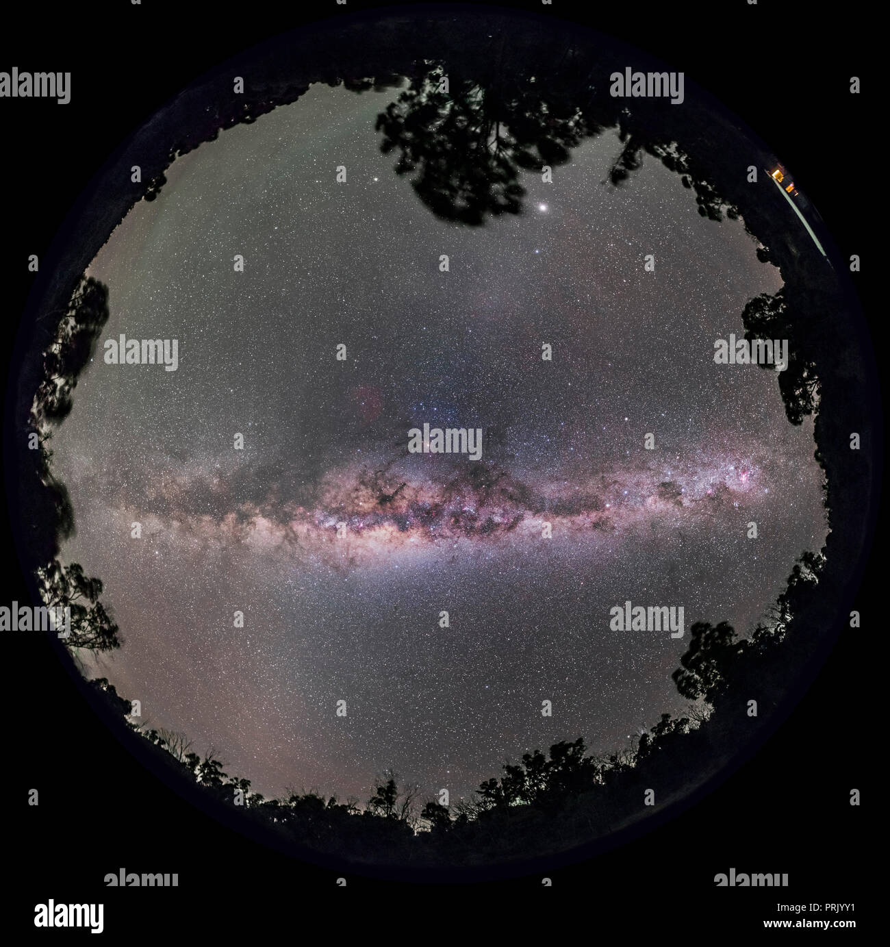 A 360° degree fish-eye panorama of the Milky Way with the Galactic Centre overhead and the spiral arms of the Galaxy symmetrically displayed to either Stock Photo