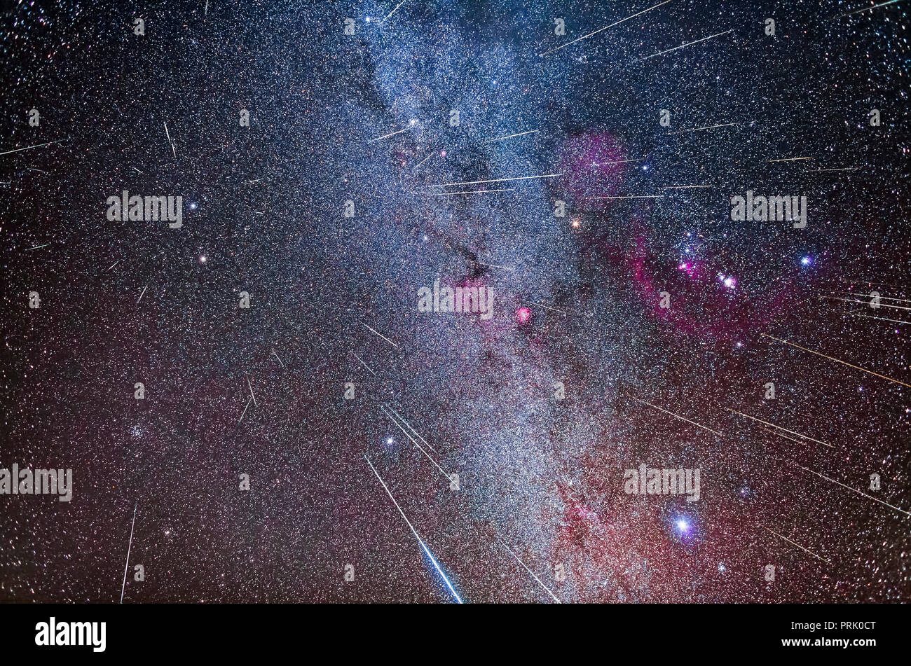 A composite showing the 2017 Geminid meteors streaking from the radiant point in Gemini at upper left, above the blue-white star Castor. 2 or 3 meteor Stock Photo