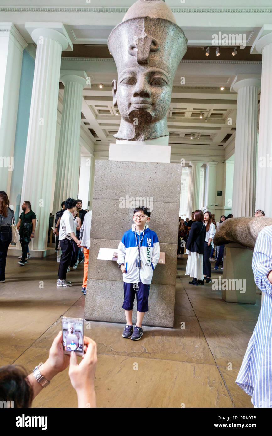 London England,UK,Bloomsbury,The British Museum,human culture history,interior inside,gallery,colossal statue,Amenhotep III,red granite,18th Dynasty A Stock Photo