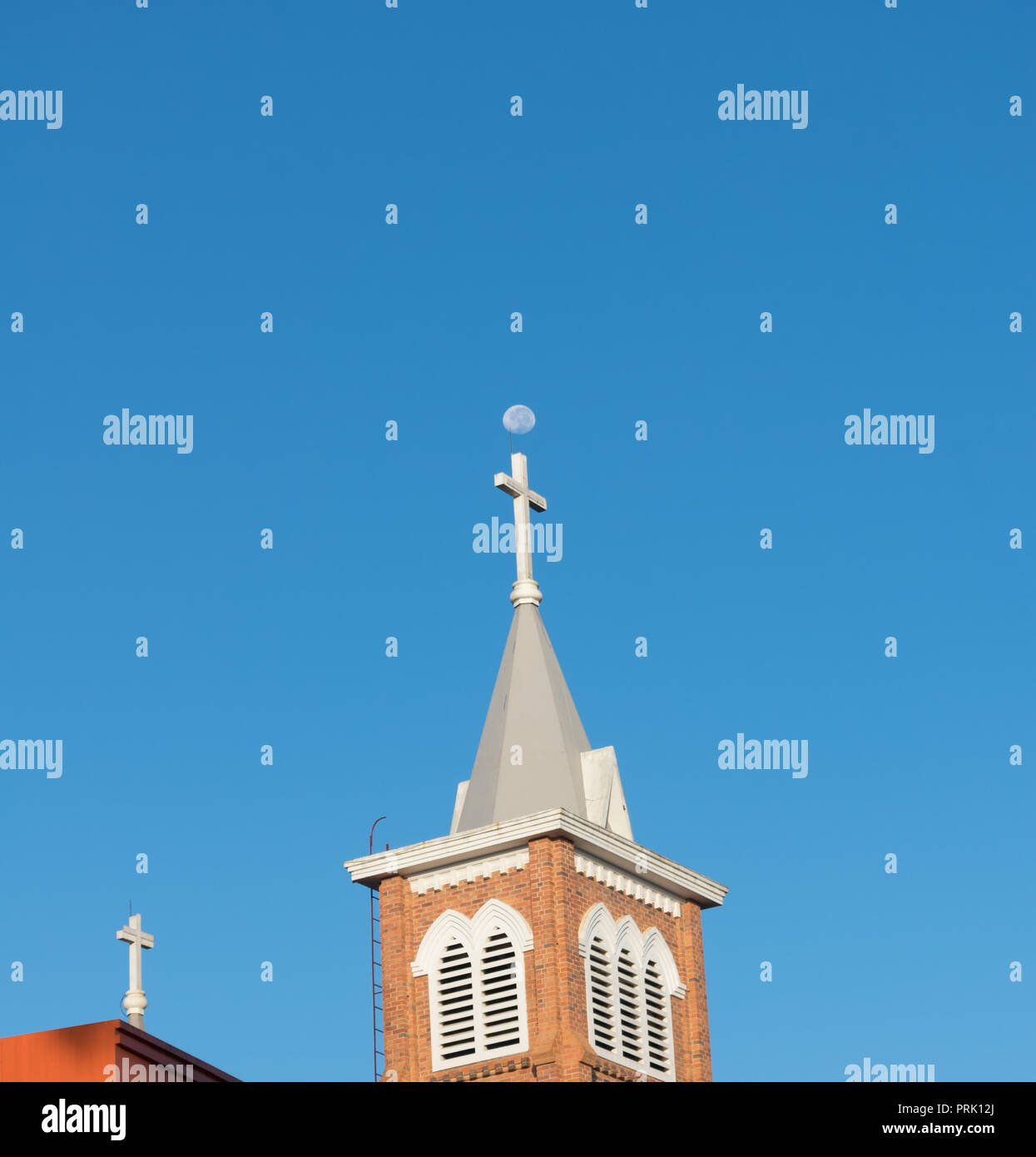 Church and moon on blue sky background at the morning Stock Photo