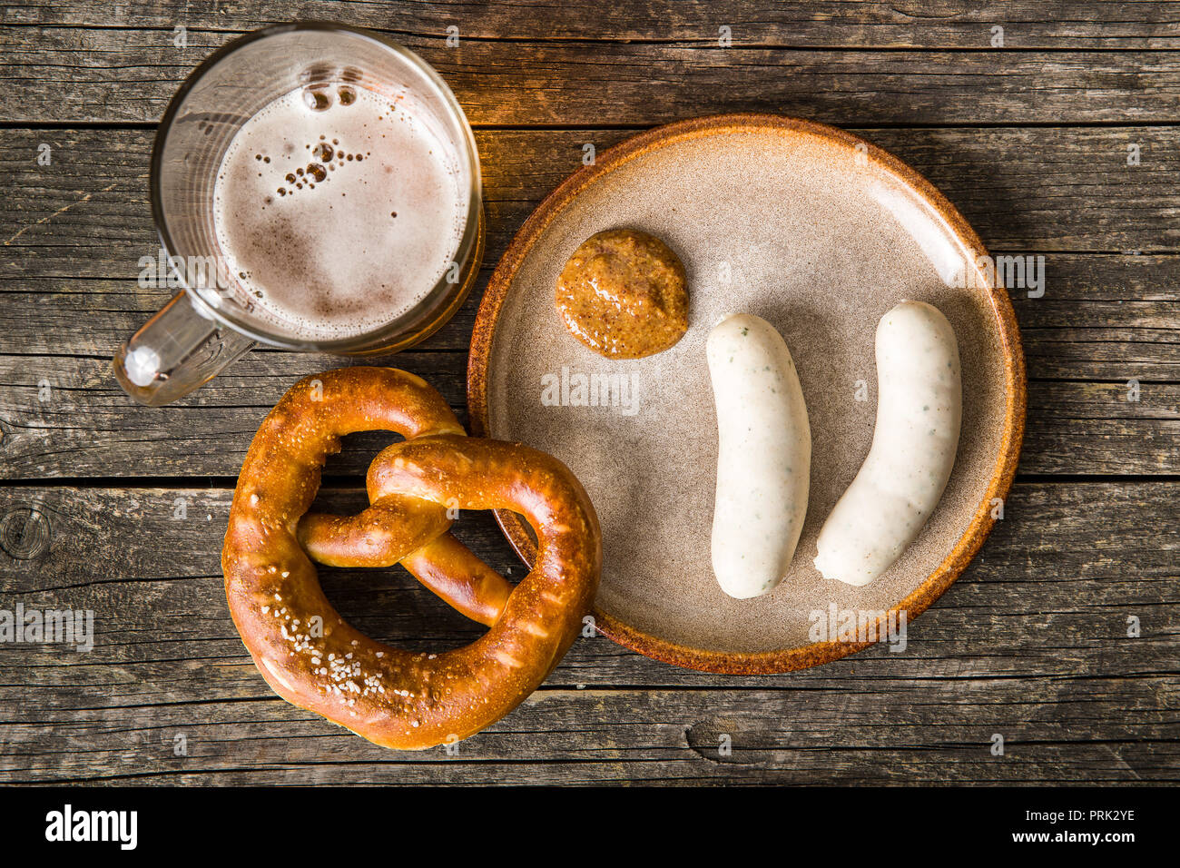 The bavarian weisswurst, pretzel and mustard. Top view. Stock Photo