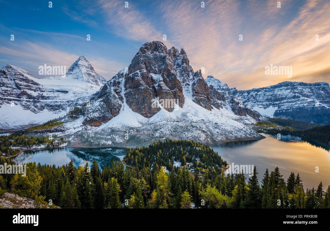 Mount Assiniboine is a pyramidal peak mountain located on the Great Divide, on the British Columbia/Alberta border in Canada. Stock Photo