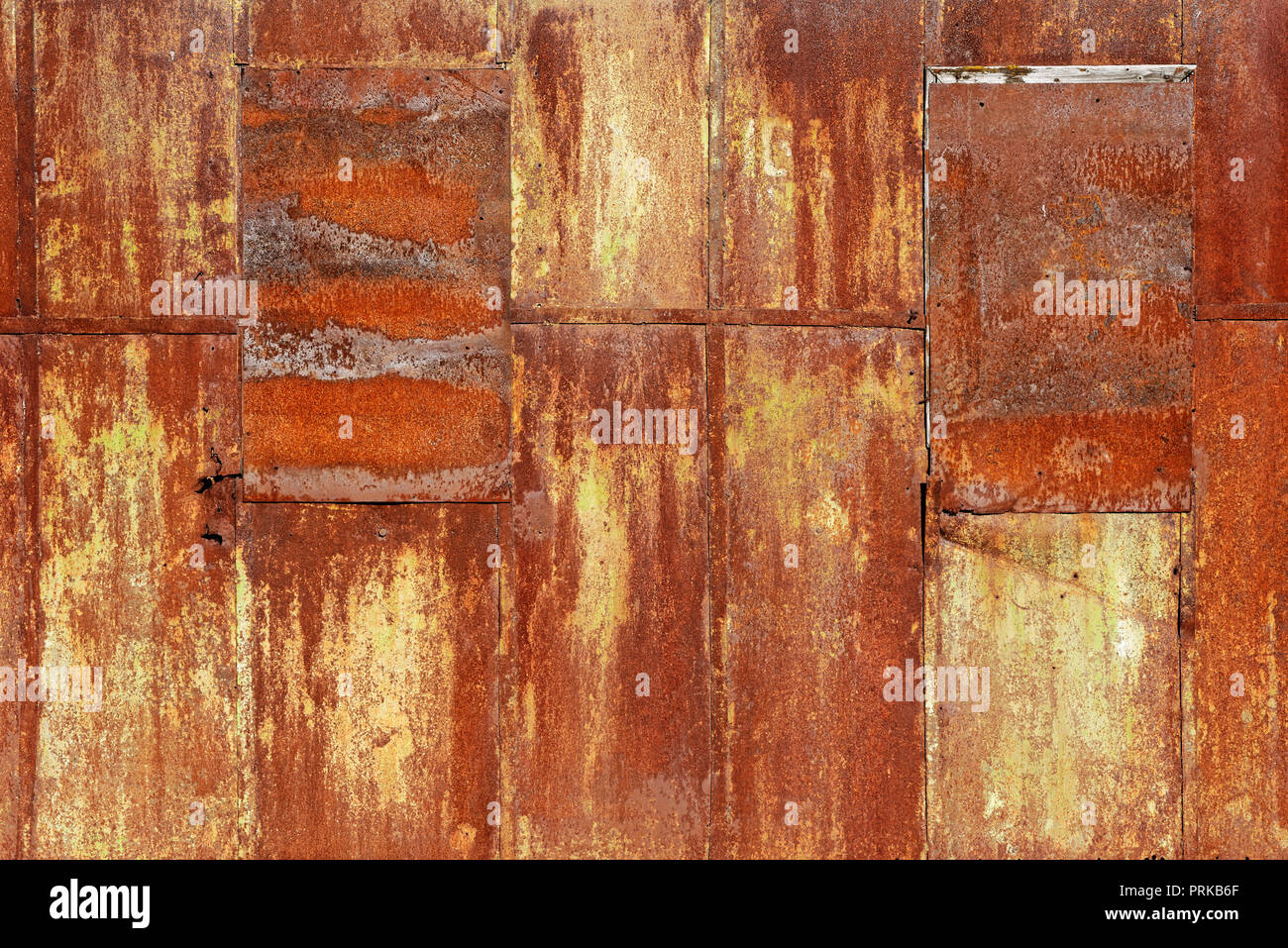 Backgrounds and textures: wall made of rusty metal sheets, uneven joints, industrial abstract Stock Photo