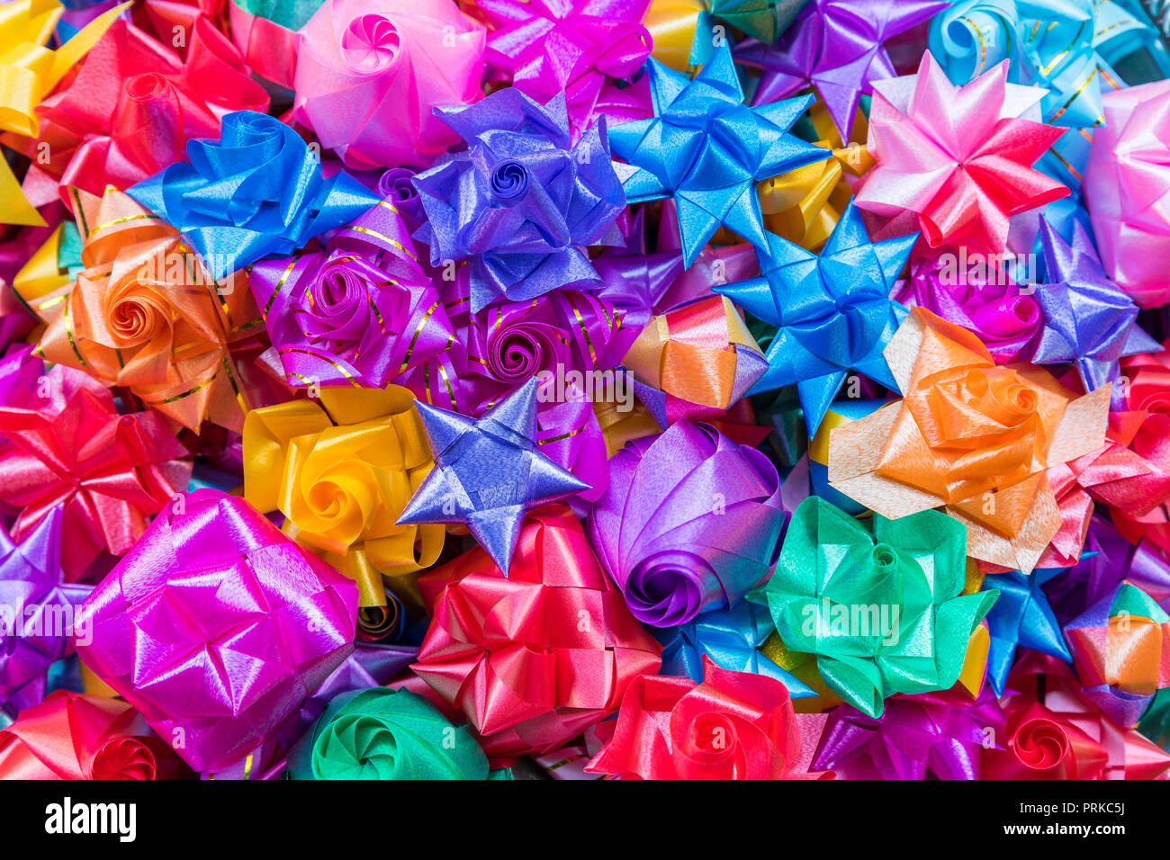 Colorful ribbon flowers for giving alms to make merit in Thai's ...