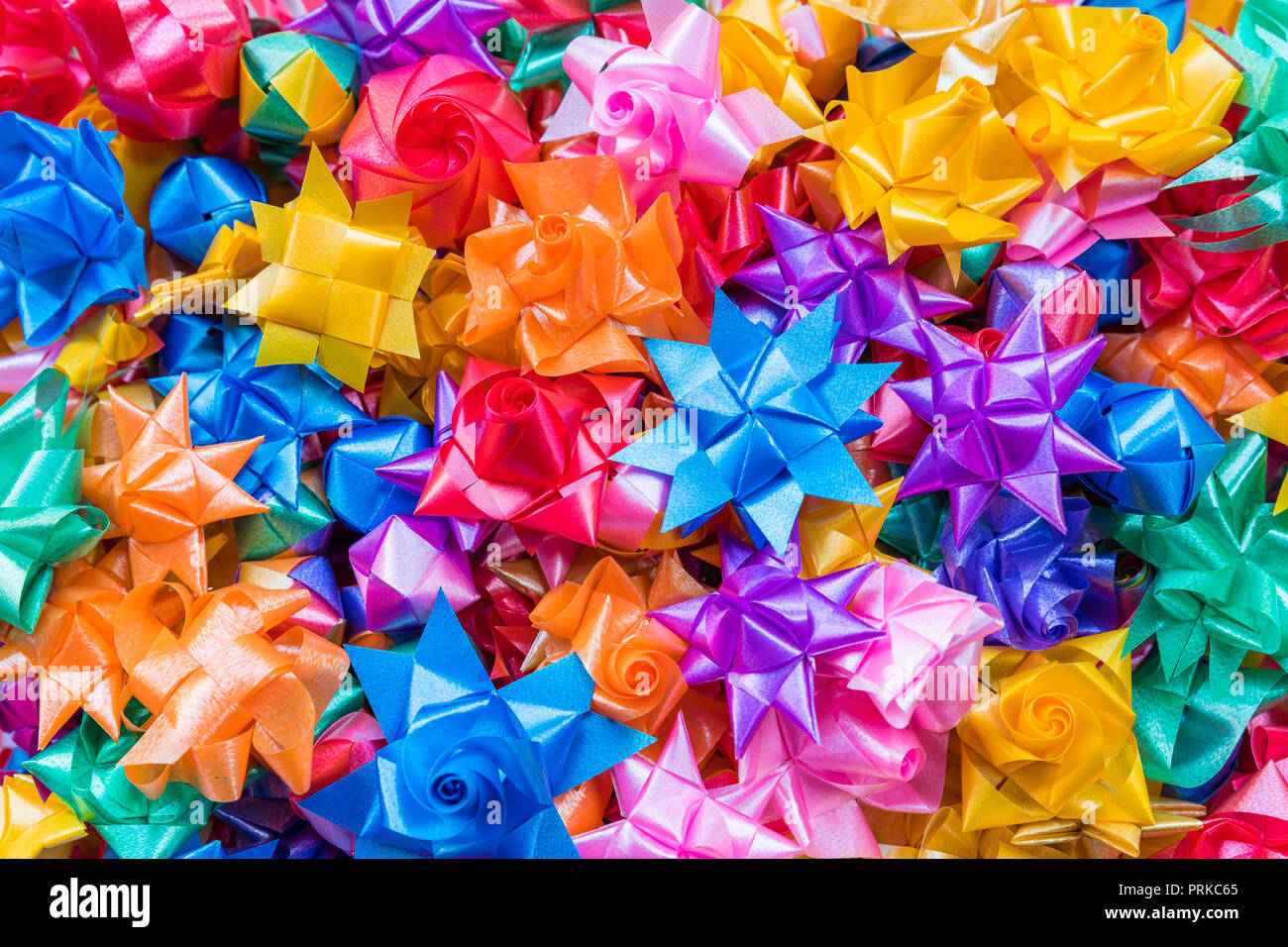 Colorful ribbon flowers for giving alms to make merit in Thai's ...