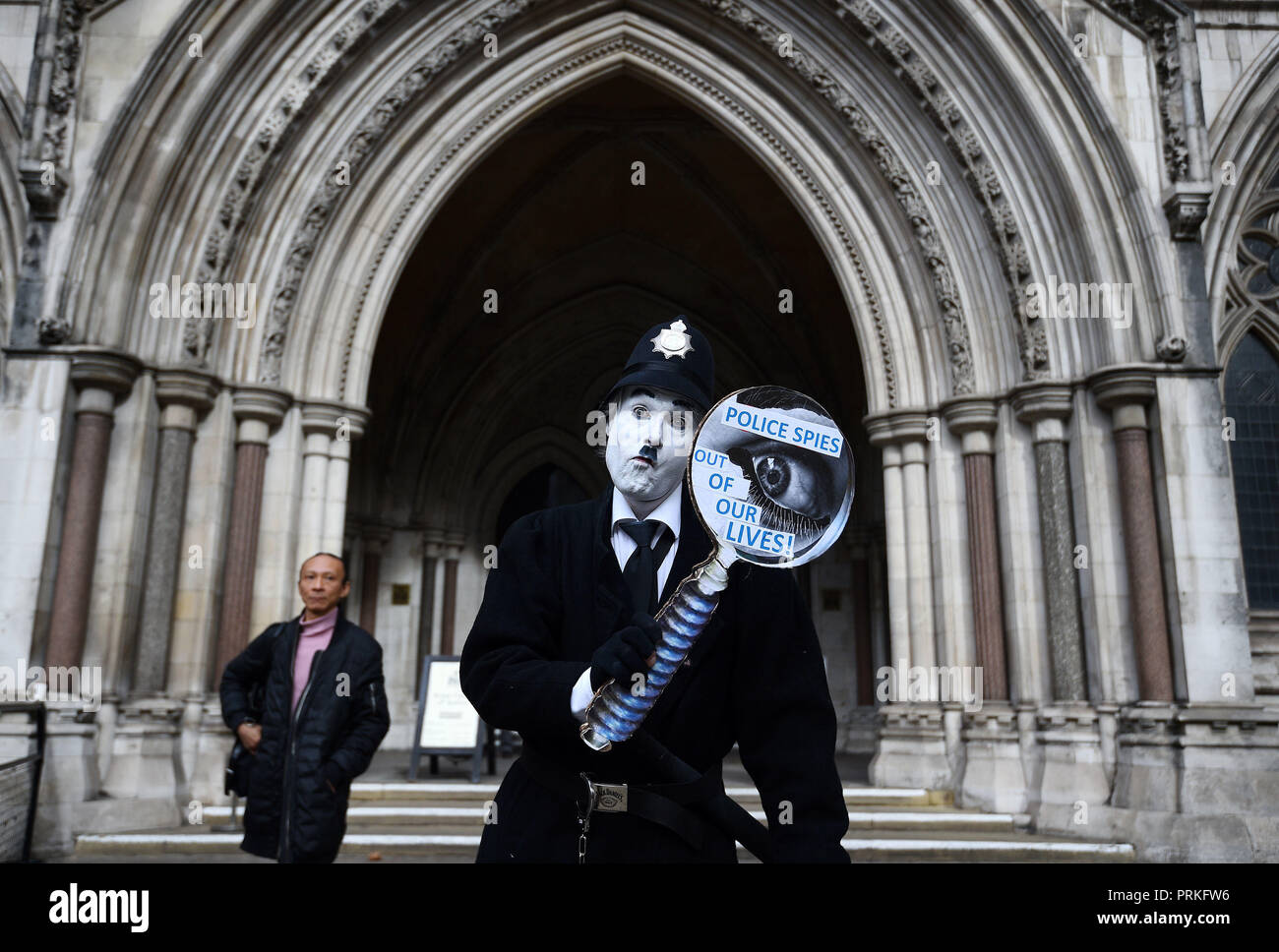 A demonstrator outside the Royal Courts of Justice, London, where an Investigatory Powers Tribunal is hearing the case of Kate Wilson who was deceived into a relationship by undercover police officer Mark Kennedy. Stock Photo