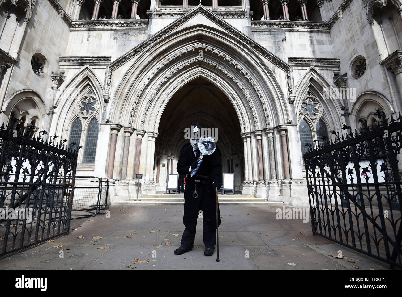 A demonstrator outside the Royal Courts of Justice, London, where an Investigatory Powers Tribunal is hearing the case of Kate Wilson who was deceived into a relationship by undercover police officer Mark Kennedy. Stock Photo