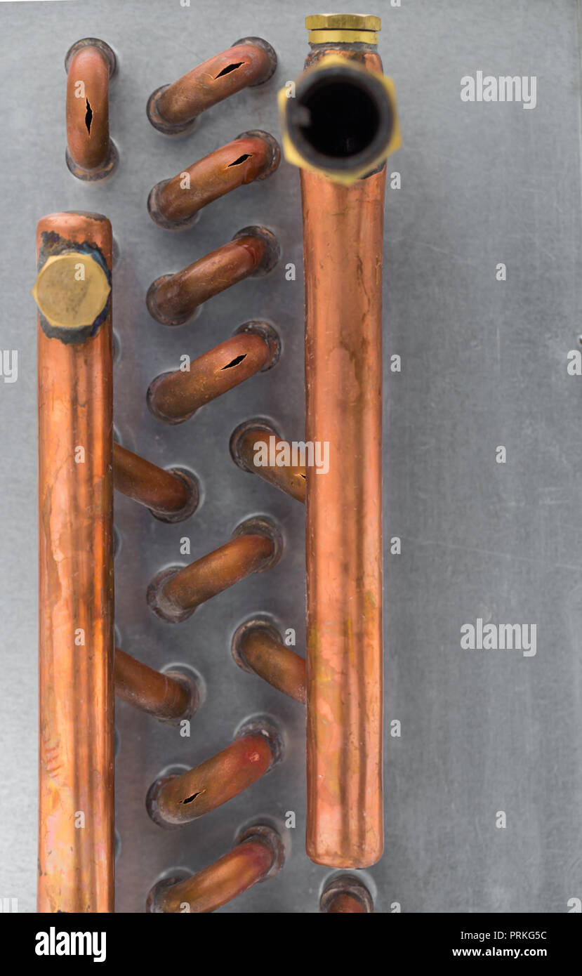burst copper pipes from the cold, closeup Stock Photo Alamy