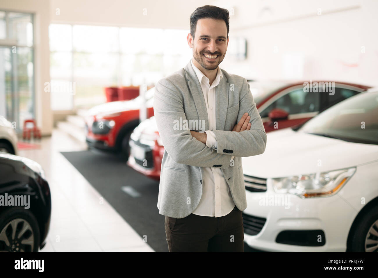 Portrait of happy customer buying new car Stock Photo