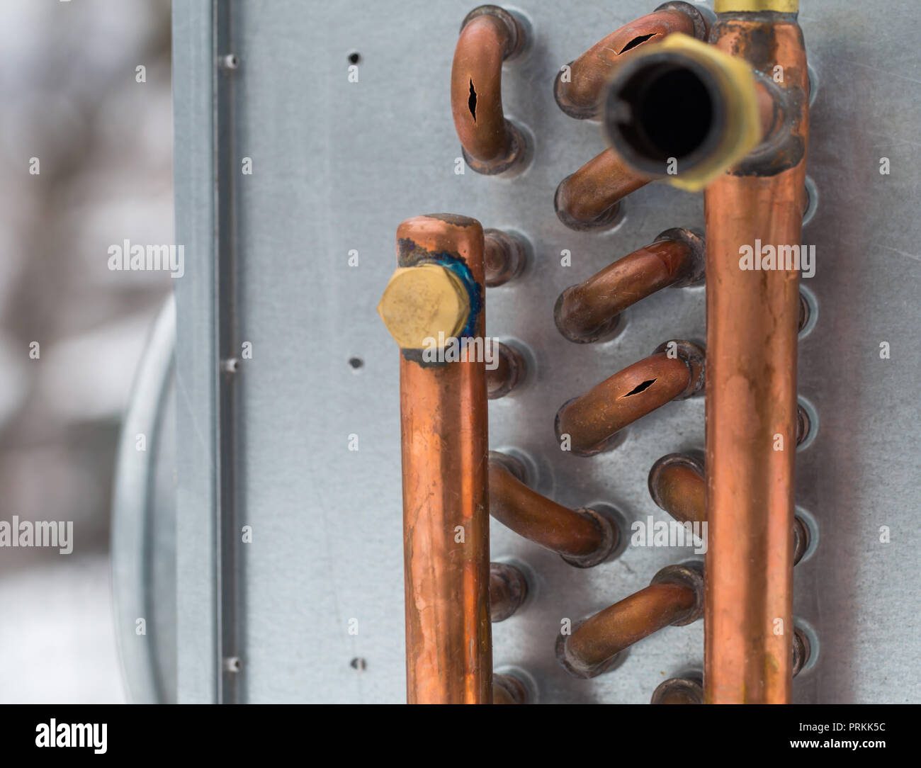 burst copper pipes from the cold, closeup Stock Photo Alamy