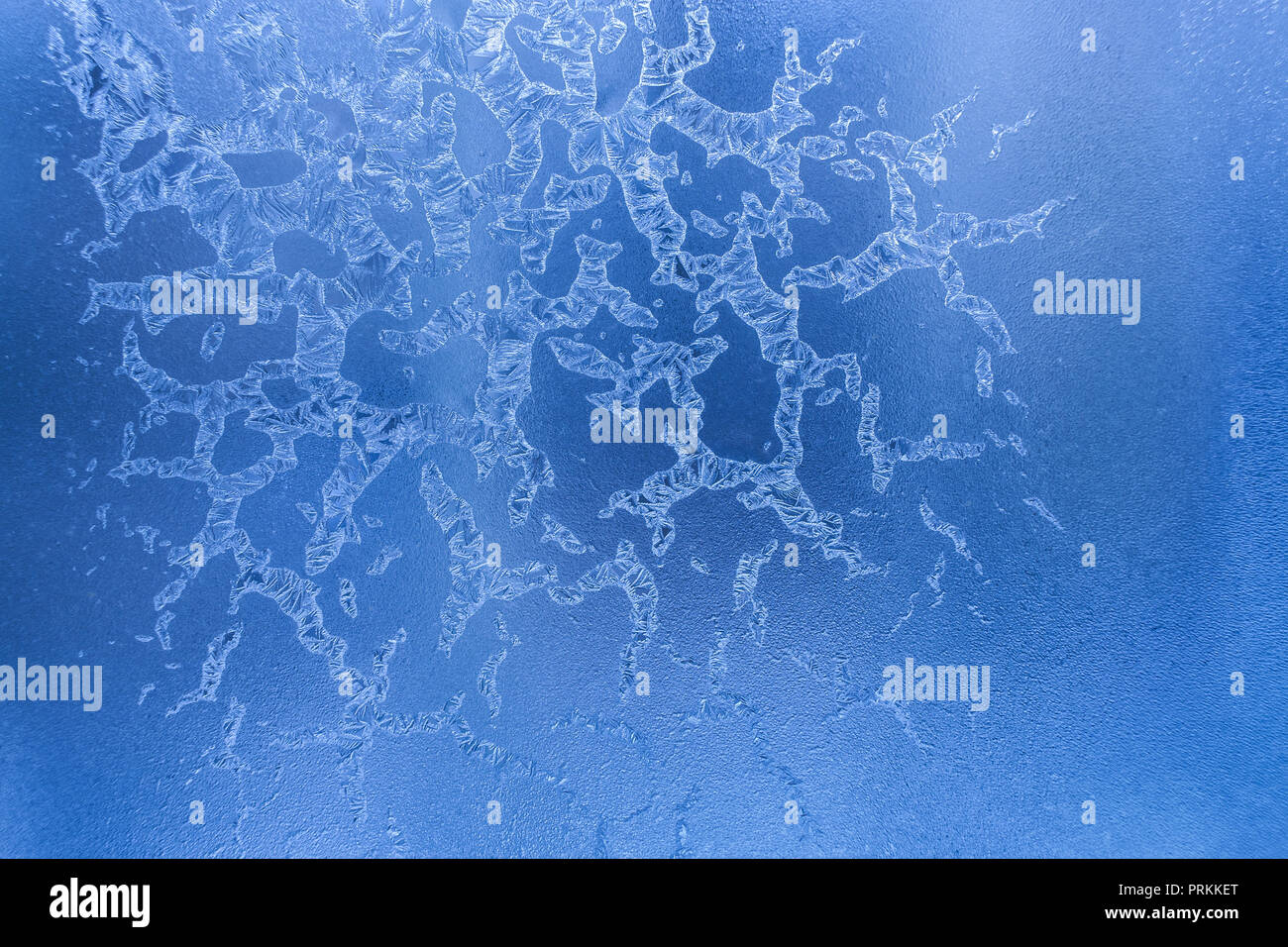 Fancy Drawing Of Ice Crystals On Blue Frozen Winter Window Stock Photo Alamy
