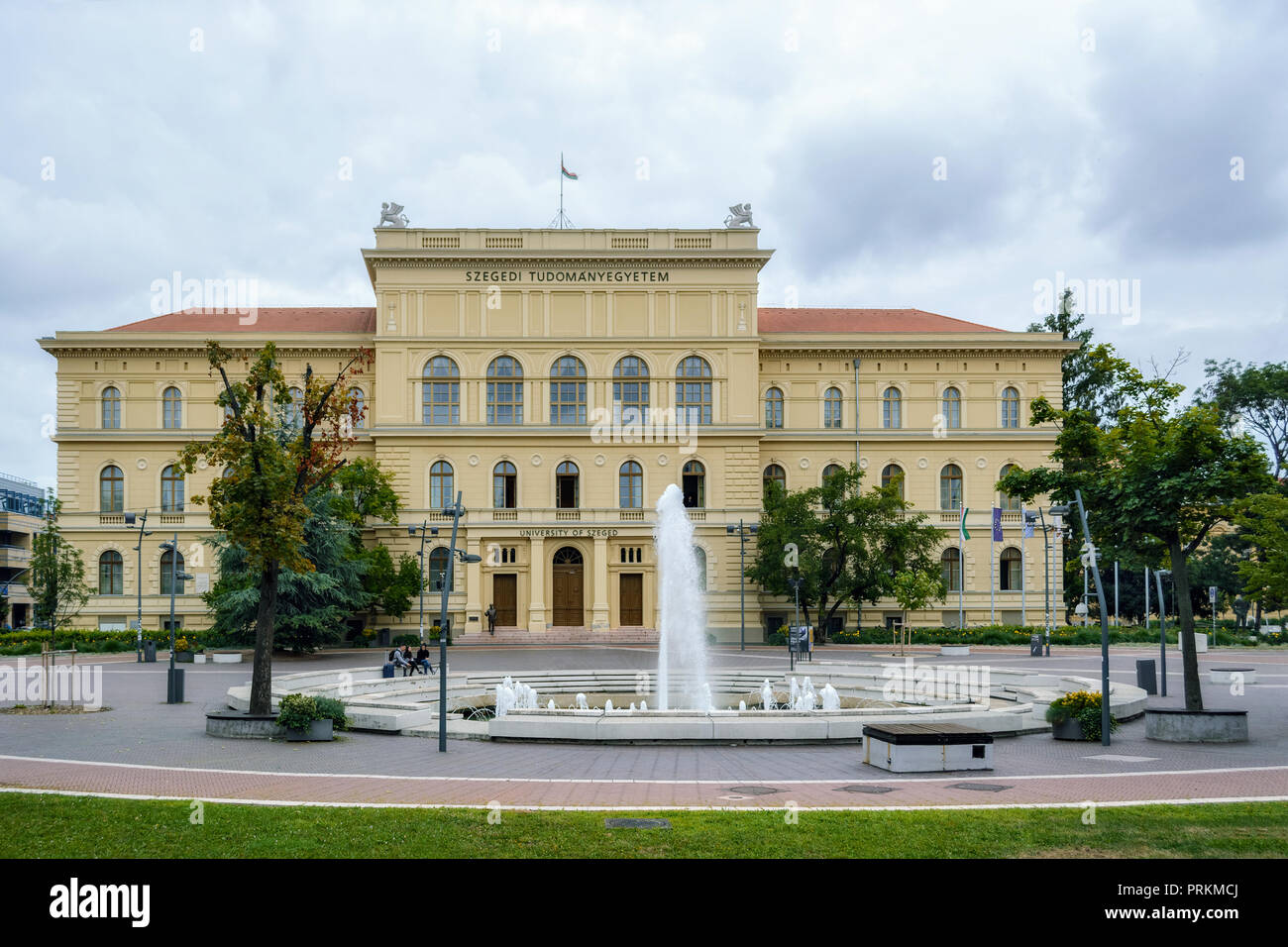 Szeged, Hungary, June 27: The main building of the University of Szeged with a fountain in the square, where students sit, June 27, 2018. Stock Photo