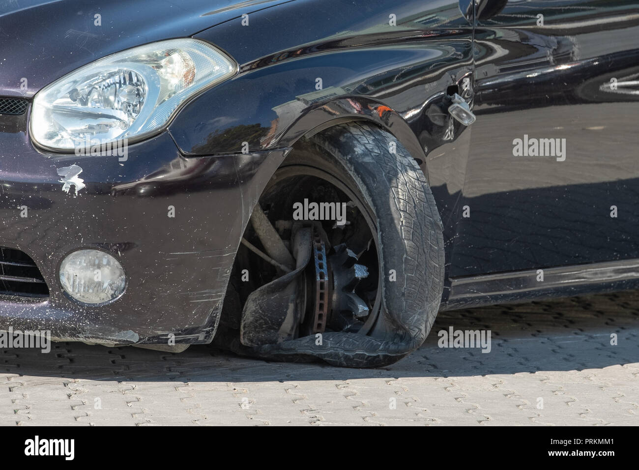 The car which had an accident with the broken forward wheel. Stock Photo