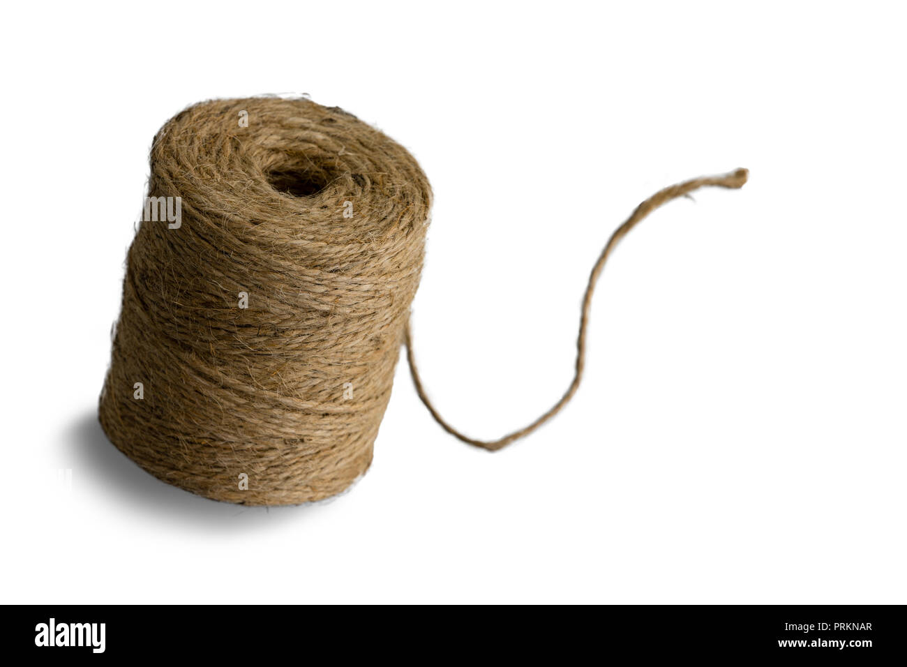 https://c8.alamy.com/comp/PRKNAR/one-cylindrical-isolated-coil-of-interwoven-brown-heavy-duty-string-with-shadow-over-plain-white-background-PRKNAR.jpg
