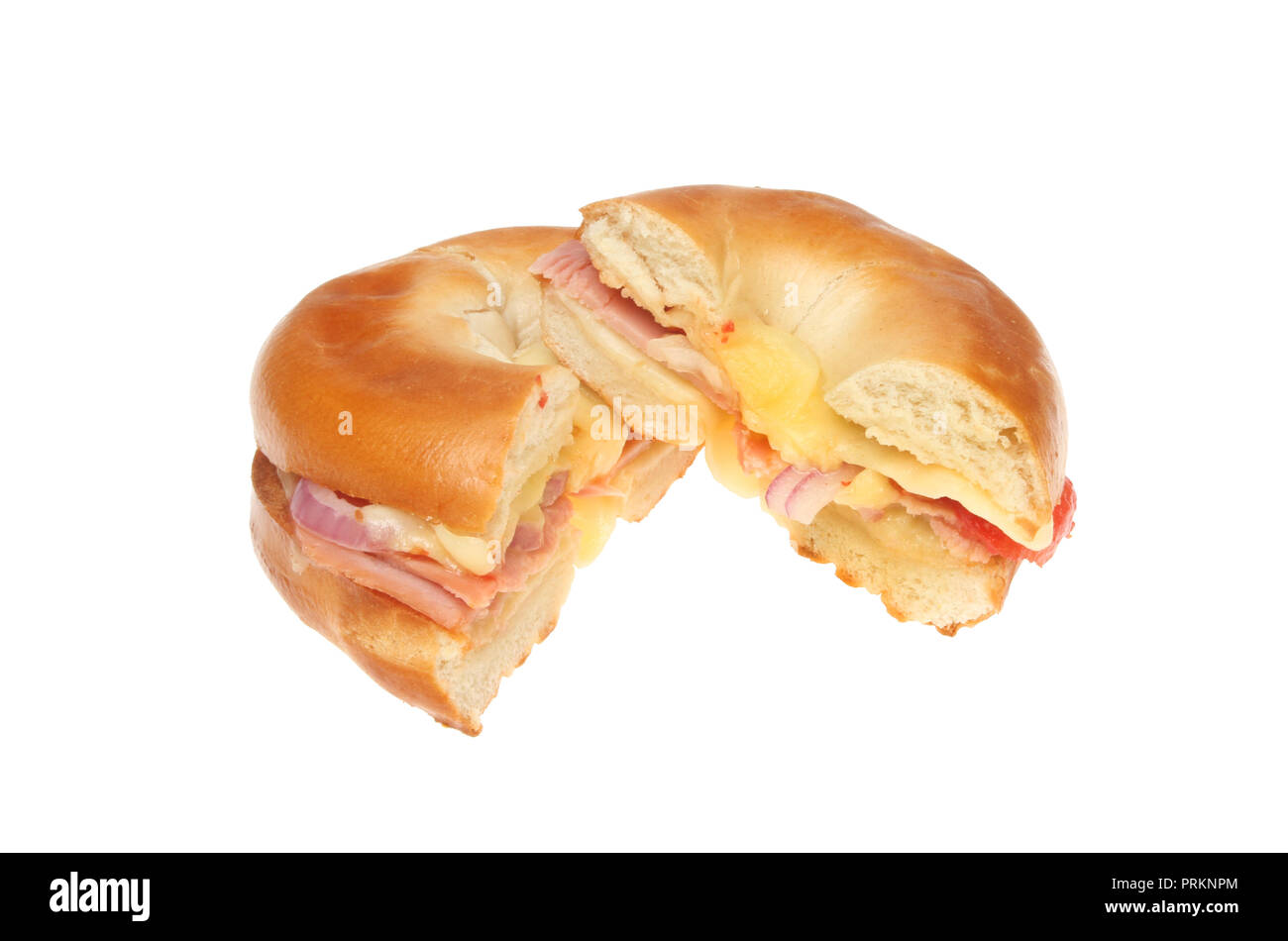 Cheese, ham, tomato and red onion toasted bagel cut in half isolated against white Stock Photo