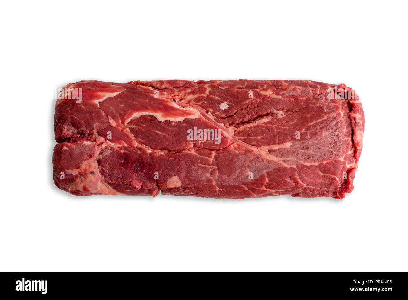 Single uncooked slab of marbled red meat centered over completely white background. Includes copy space. Stock Photo