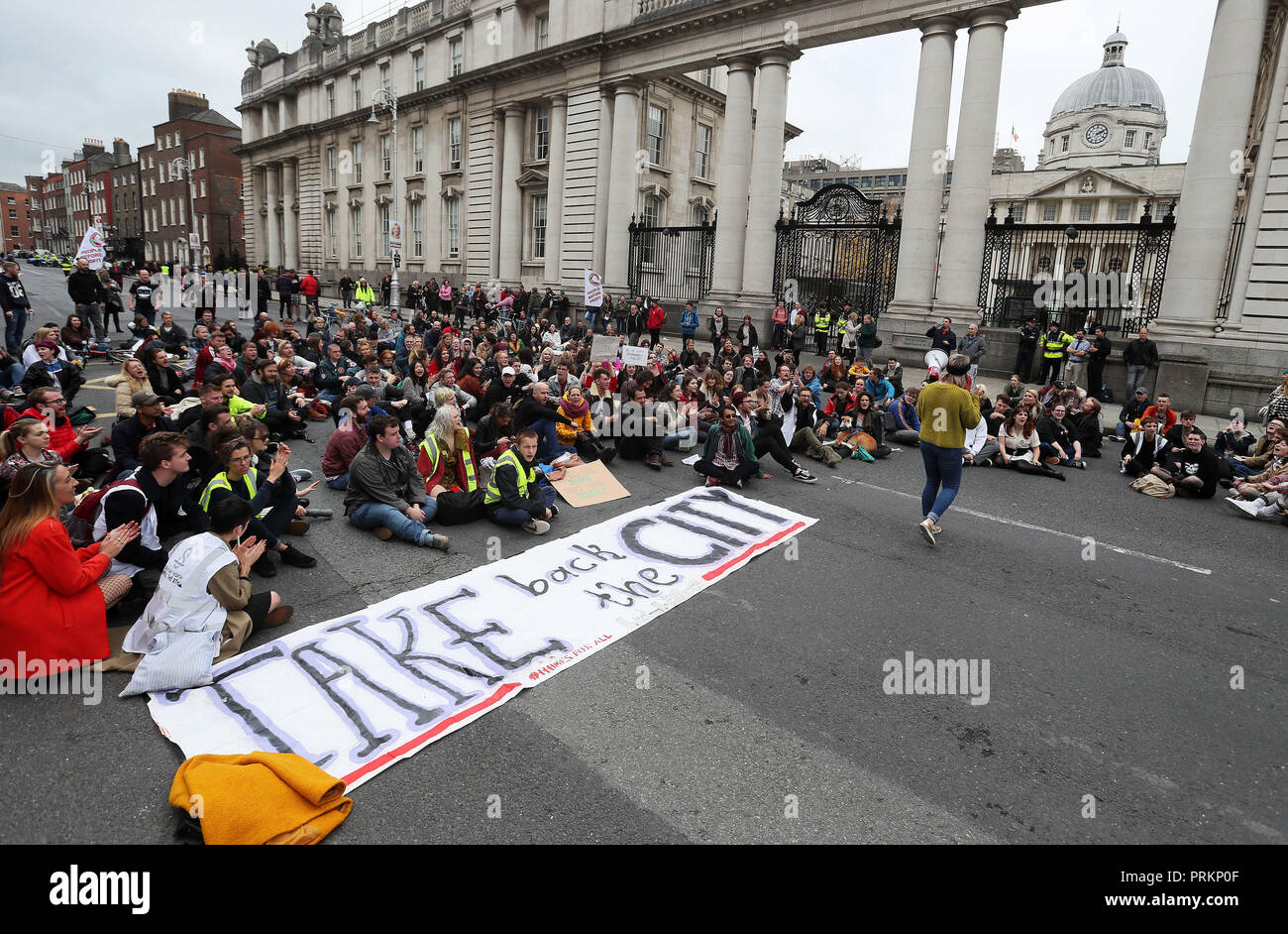 People stage a sit down protest outside the Department of An Taoiseach in Dublin's city centre following a Raise the Roof housing rights protest. Stock Photo