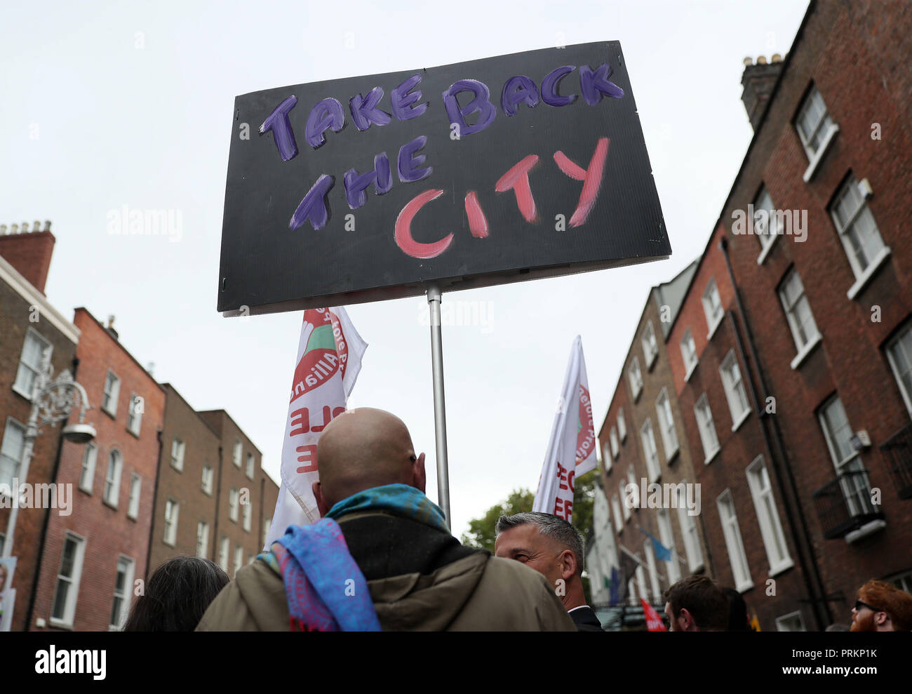 People gather outside Leinster House in Dublin during a Raise the Roof housing rights protest. Stock Photo