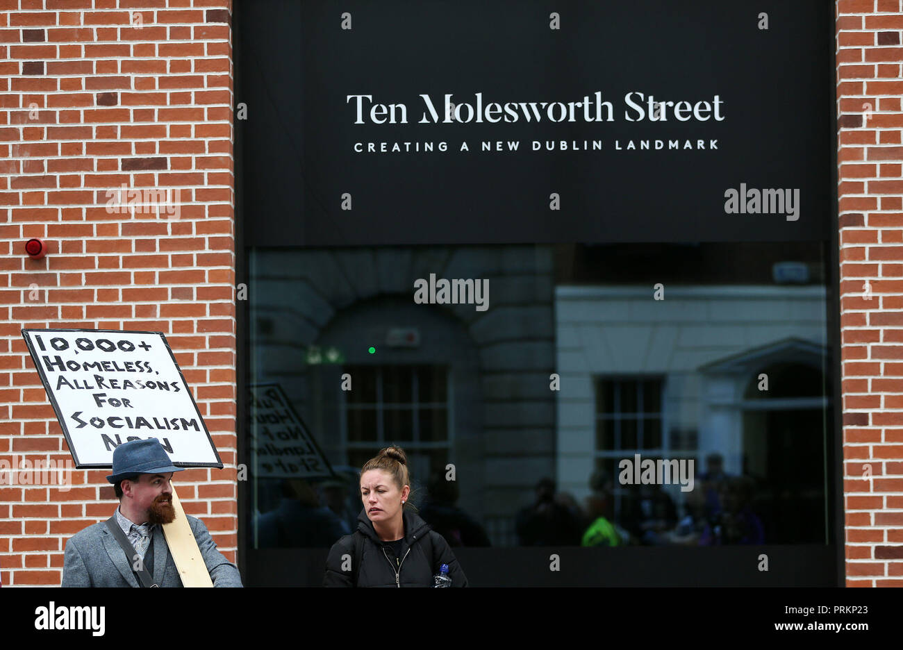 People gather outside Leinster House in Dublin during a Raise the Roof housing rights protest. Stock Photo