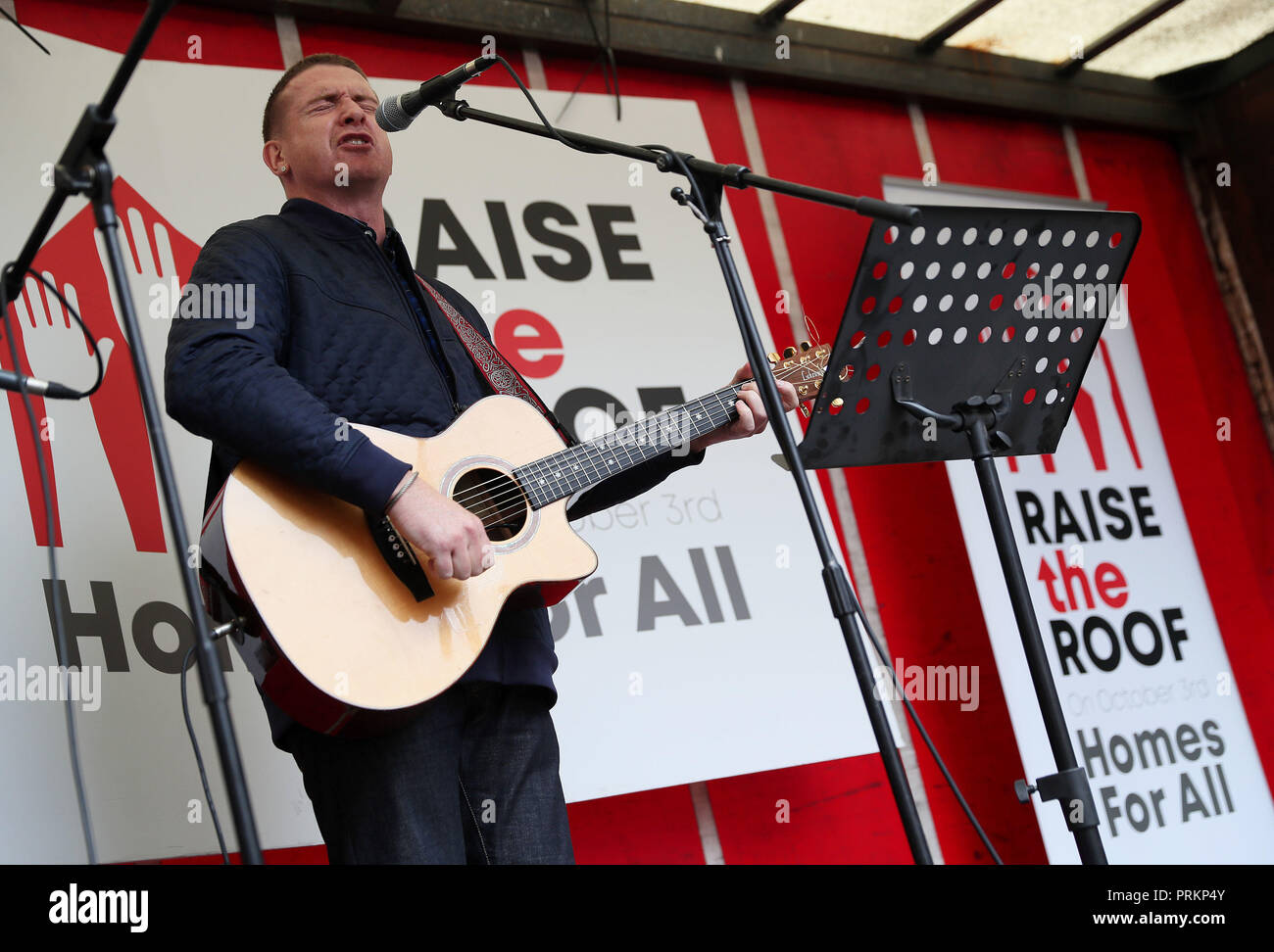Damien Dempsey performs outside Leinster House in Dublin during a Raise the Roof housing rights protest. Stock Photo