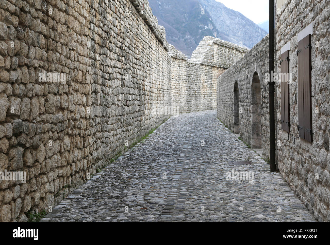 View of ancient wall with stones in the medieval village Stock Photo - Alamy