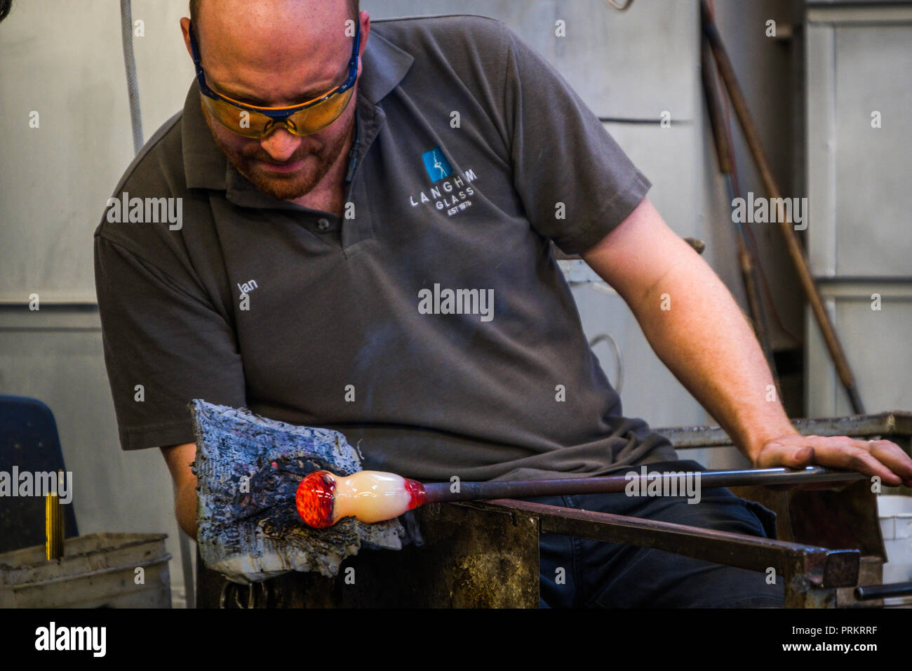 Glass Blowing Workshop - Two Women Shaping glass on the Blowpipe Stock  Photo - Alamy
