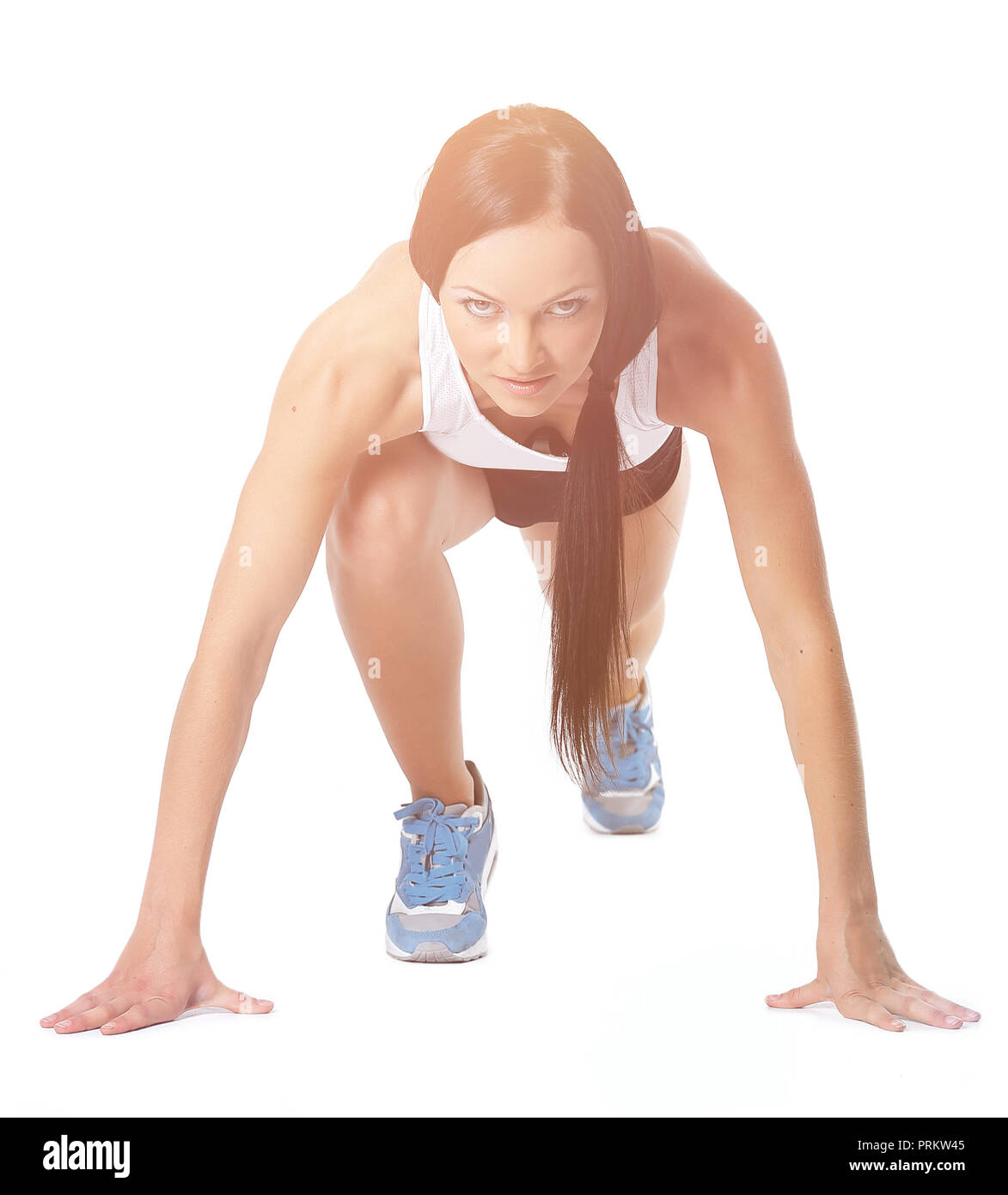 Attractive fitness woman doing low start cross fit exercises Stock Photo