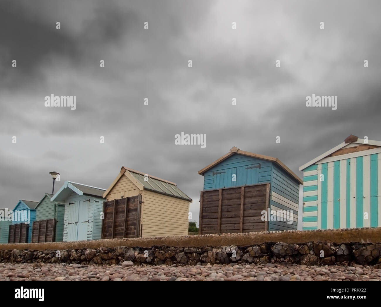 Boarded up beach huts at Budleigh Salterton, East Devon, UK out of season, winter. Stock Photo