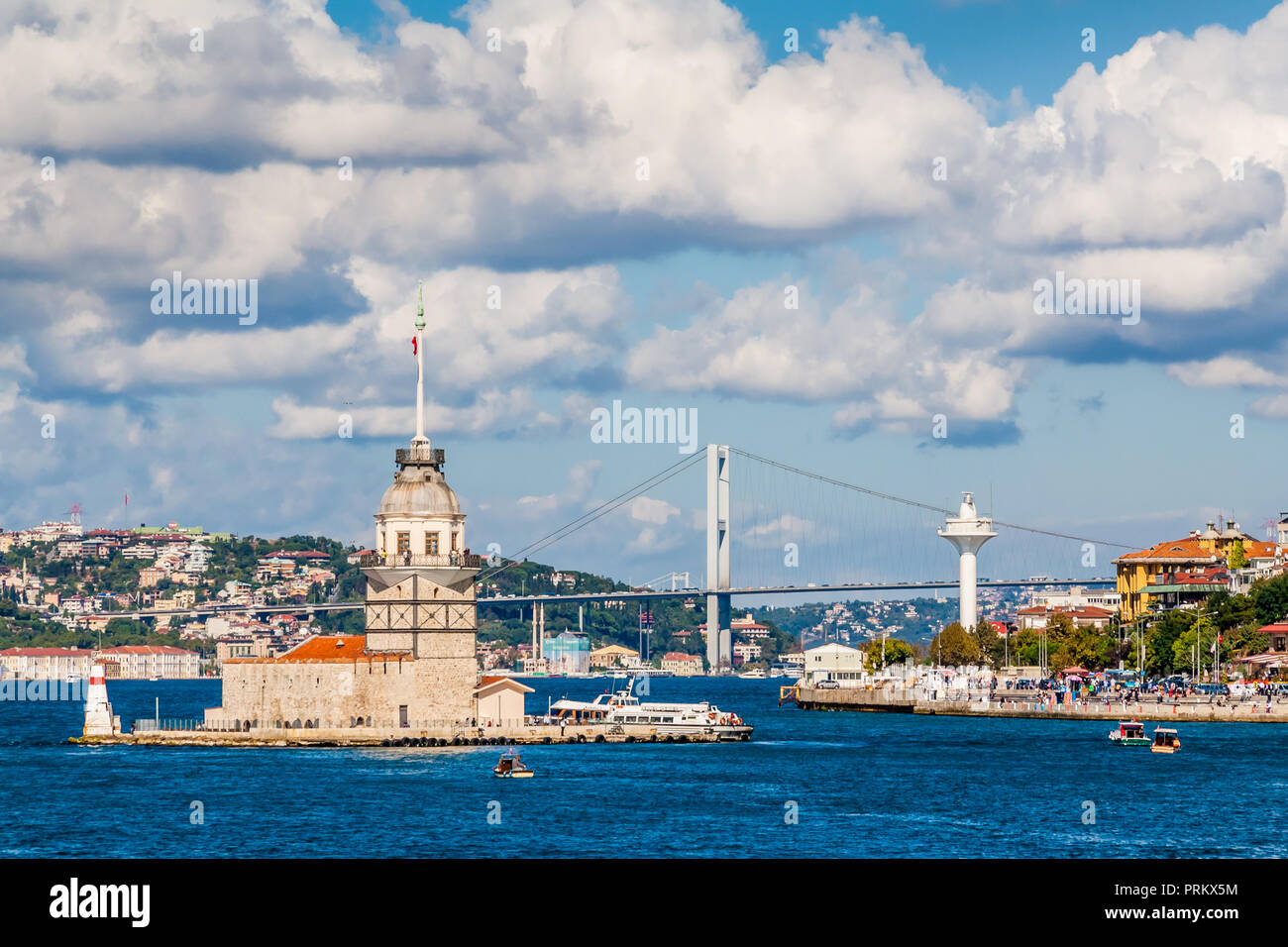 Close-up of the Maiden's Tower (Kiz Kulesi), with the Bosphorus bridge behind it, in Istanbul, Turkey. Stock Photo