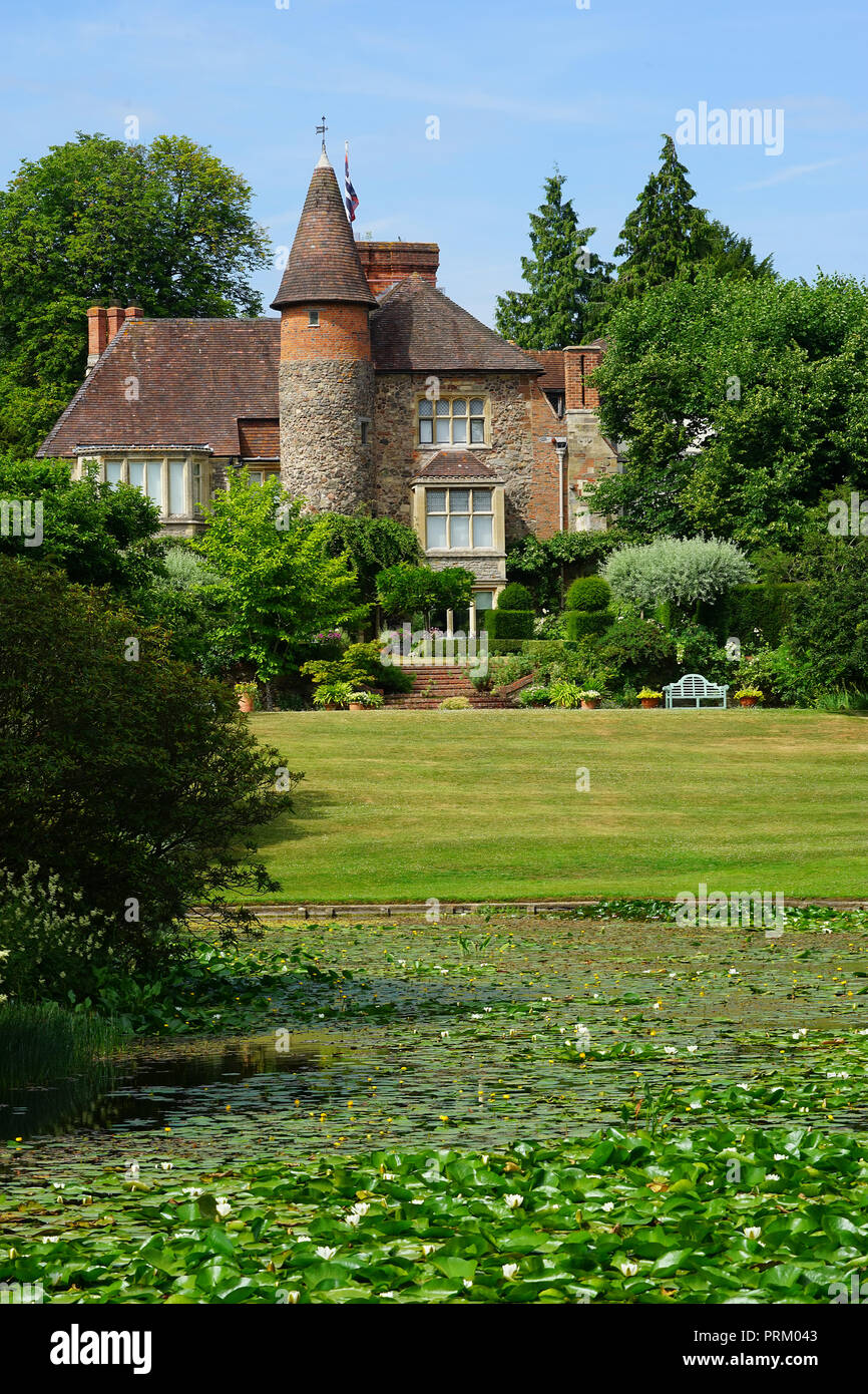 A view across the lake at Little Malvern Court Stock Photo