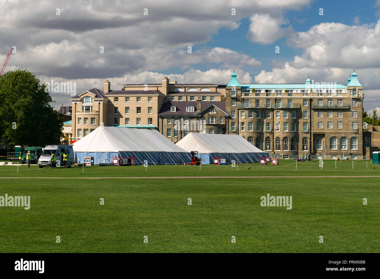 View of University Arms hotel with Parker's Piece grass park with marquees being erected on it, Cambridge, UK Stock Photo