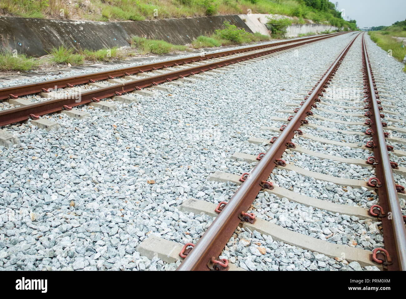 Along the railway in line of sight in Chonburi province, Thailand Stock Photo