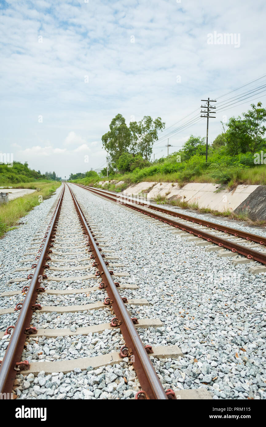 Along the railway in line of sight in Chonburi province, Thailand Stock Photo