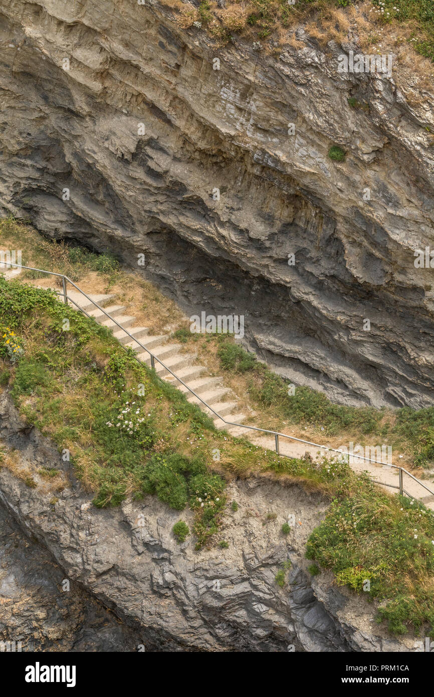 Steep steps leading to/from beach at Newquay, Cornwal .For climbing career ladder, corporate ladder. Also housing ladder / property ladder, long climb Stock Photo
